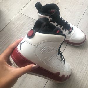 Jordan 9’s in a red, white, and black color way